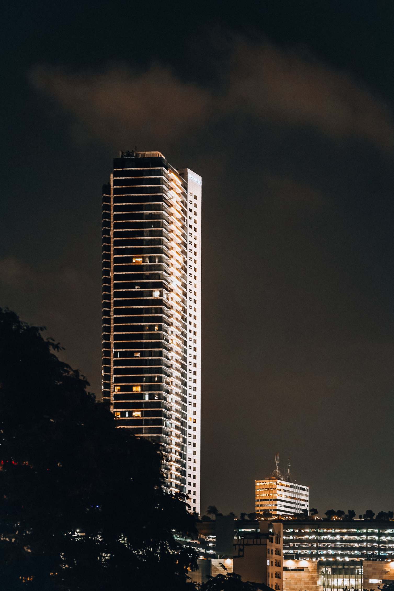 Illuminated office building at night showcasing modern architecture